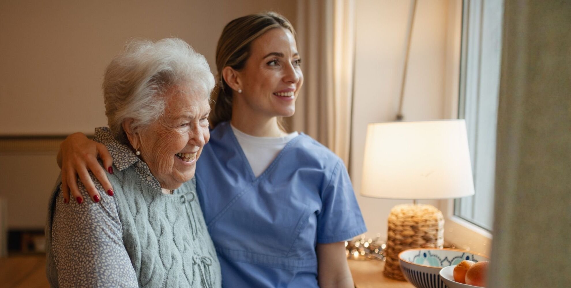 Senior Woman and Care taker blue scrubs 1920